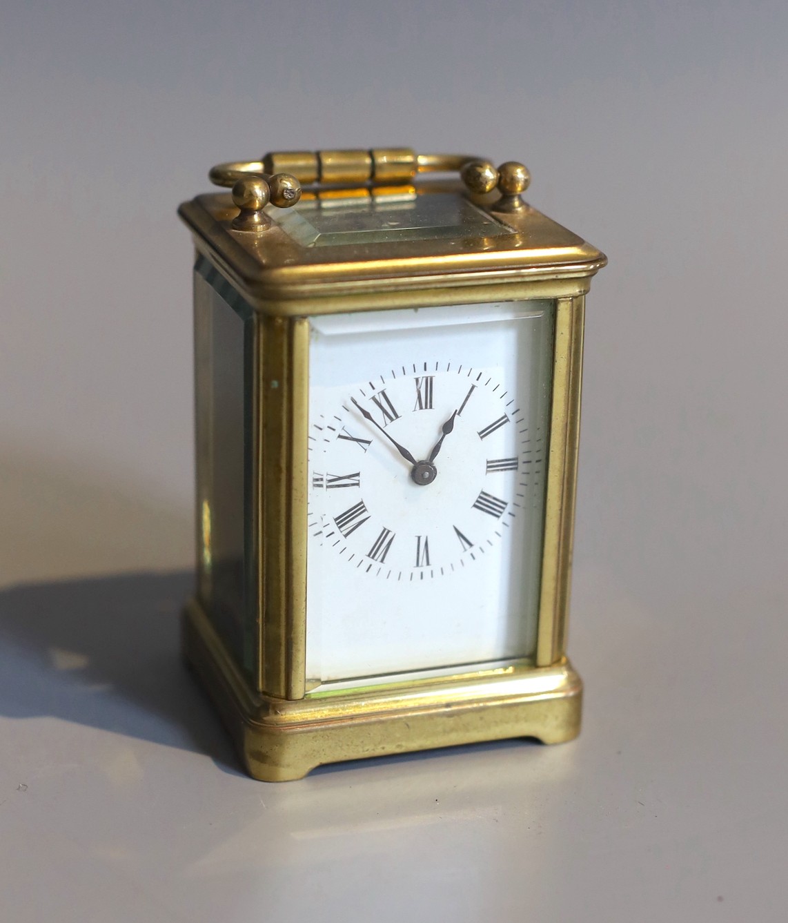 A 19th century French lacquered brass miniature carriage timepiece, height 7cm